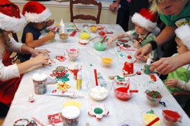 Kids decorating cookies at the Beyond Wonderful decorating party.